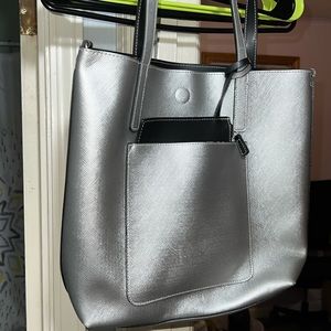 Silver purse with wallet attached